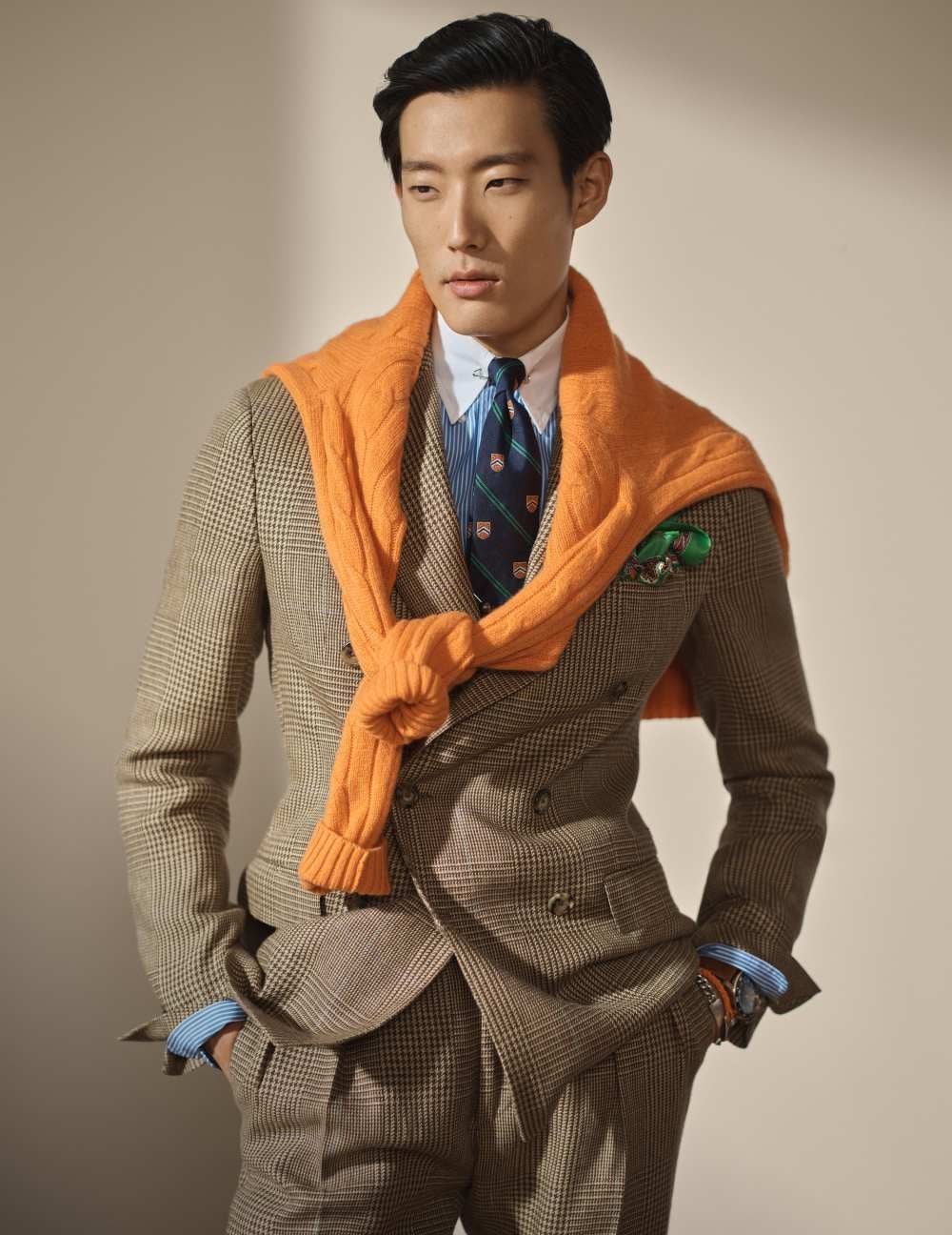 Man wears brown checkered suit and pants.