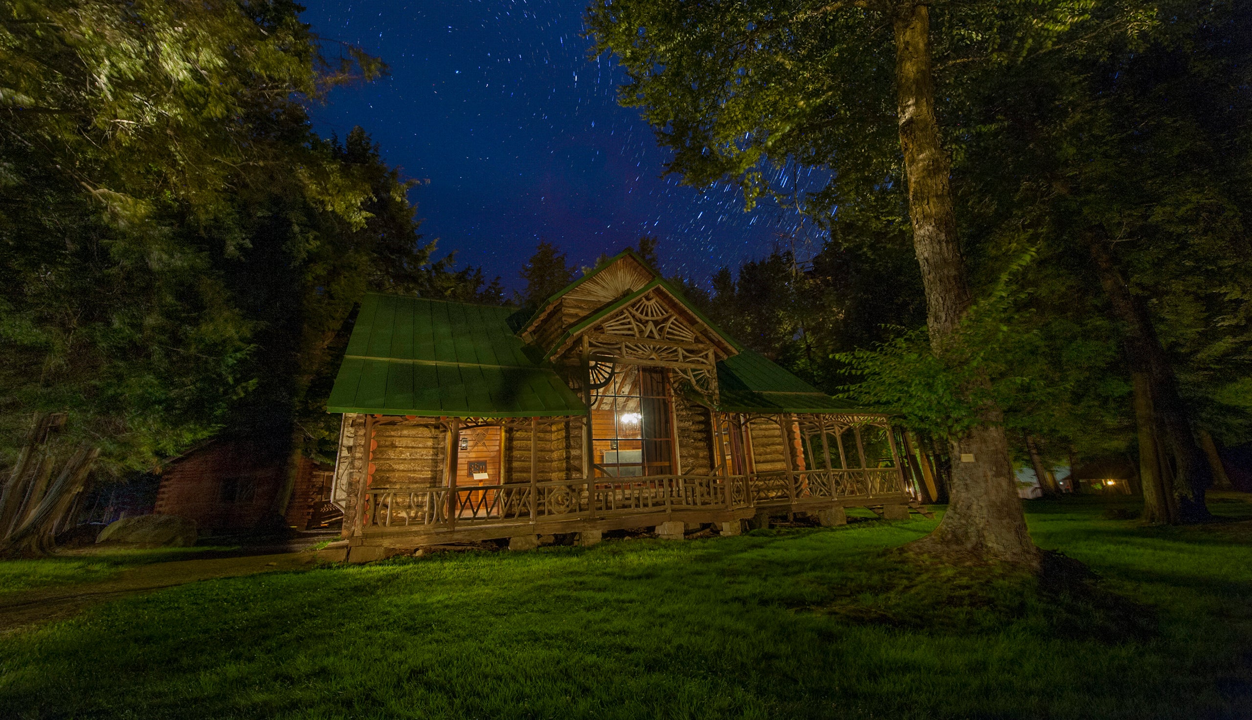 Seen here at night, Great Camp Pine Knot became William West Durant&rsquo;s most enduring legacy