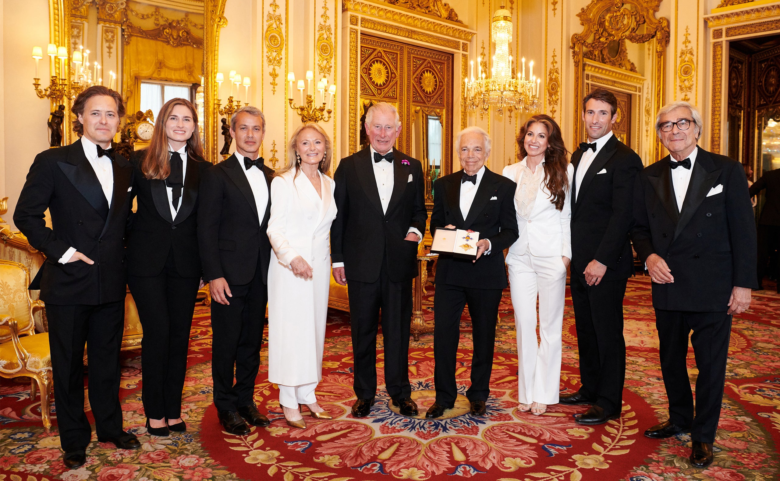 David Lauren, Lauren Bush Lauren, Andrew Lauren, Ricky Lauren, His Royal Highness The Prince of Wales, Ralph Lauren, Dylan Lauren, Paul Arrouet, and Jerry Lauren at Buckingham Palace.