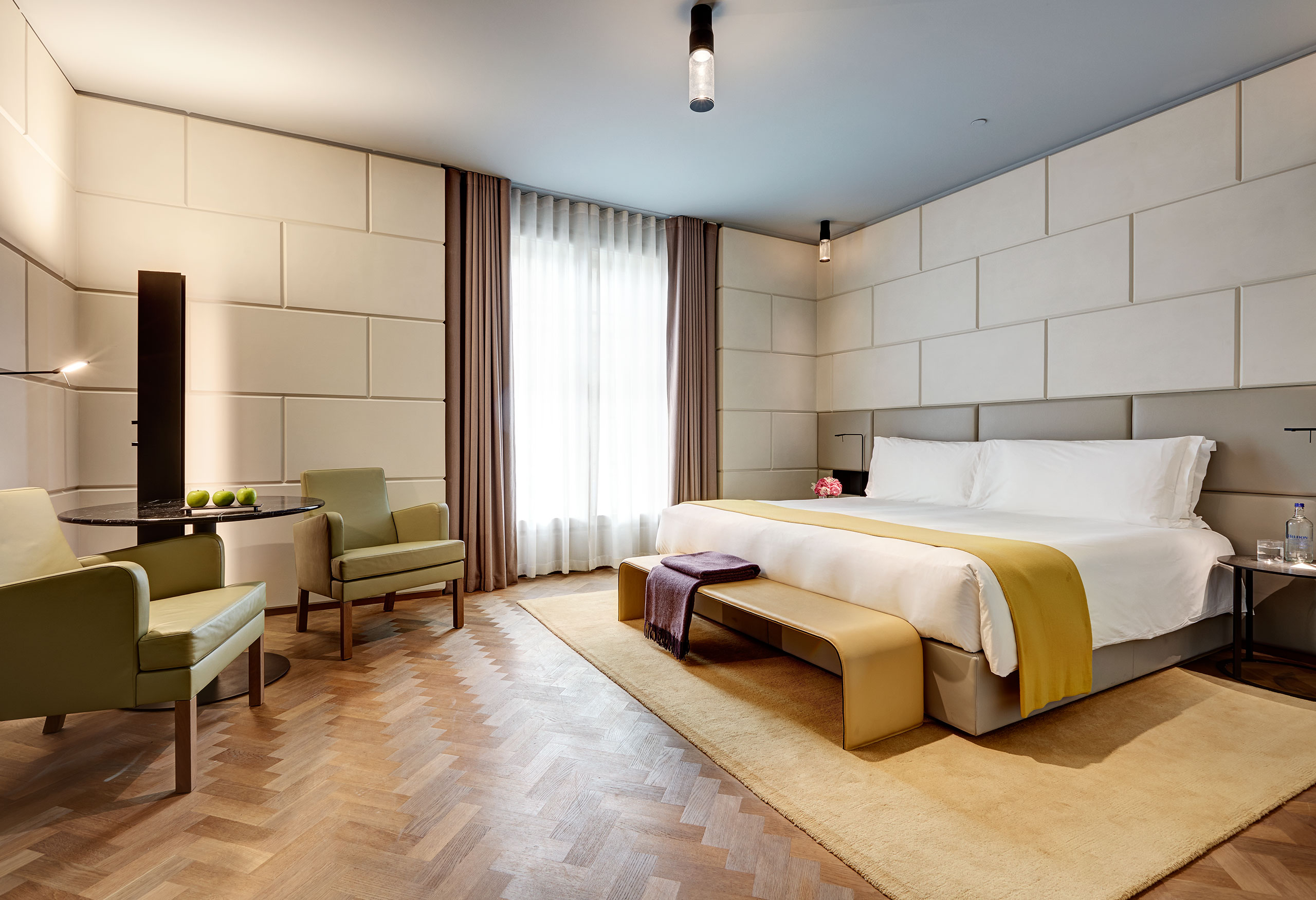 Chevron parquet floors and muted colors in the Regent Suite bedroom