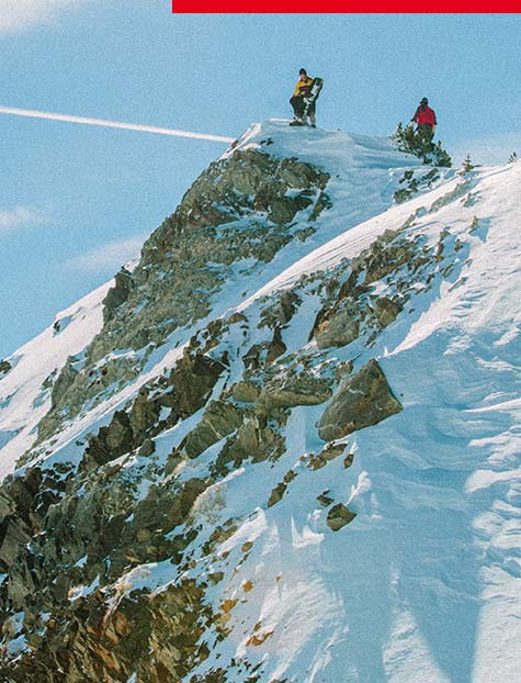 Man in Snow Beach outerwear & backpack on snowy mountain