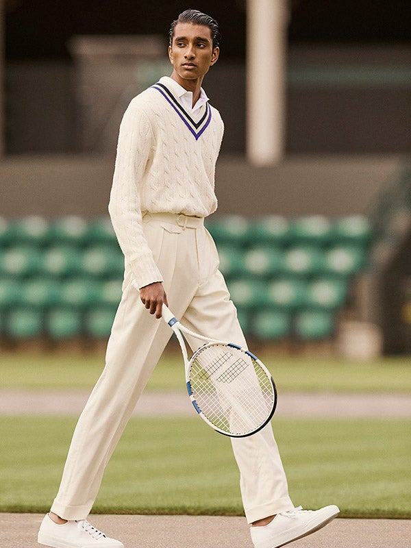Full length photo of man playing tennis