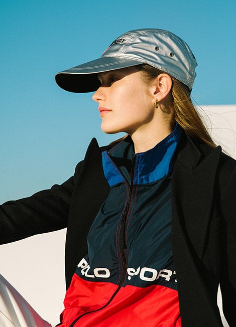 Woman in metallic cap & color-blocked Polo Sport jacket