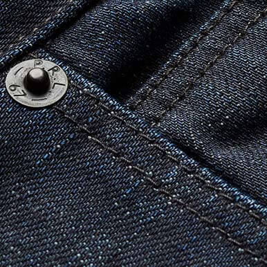 Close-up photograph of washer-burr rivet