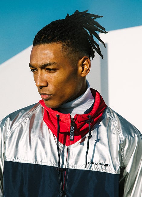 Man in silver & navy jacket with red contrast collar