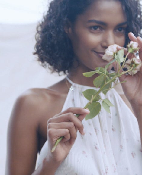 Woman in floral dress with delicate halter straps
