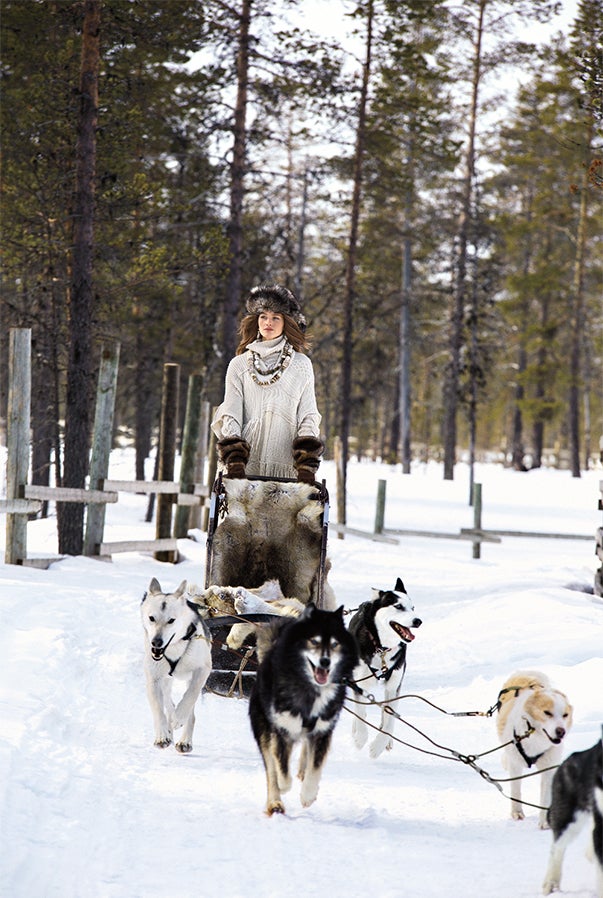 Huskies carry a Ralph Lauren model across the resort's stunning terrain.